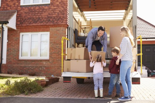 Professional movers transporting household items during a Waterloo relocation