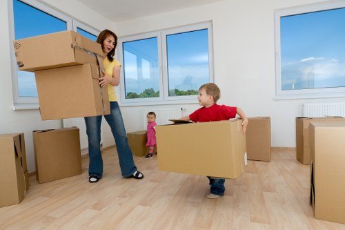 House movers carrying furniture through a Waterloo building