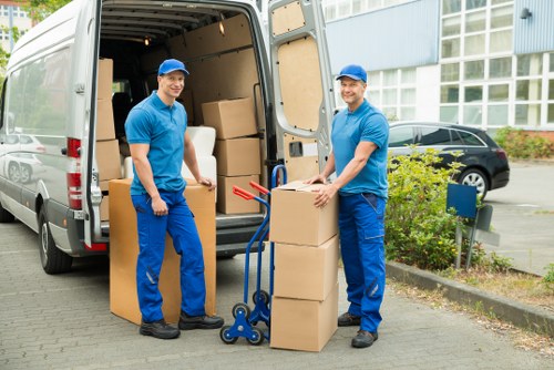 Office relocation service with desks and equipment being moved