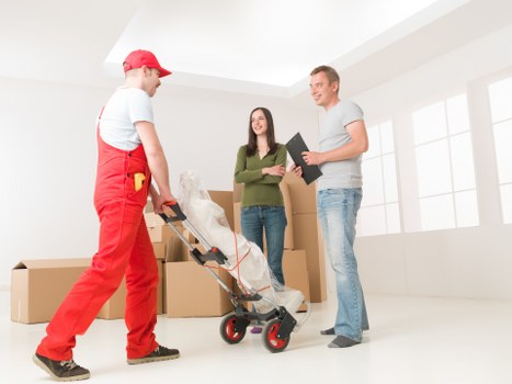 Packed household boxes ready for collection by movers