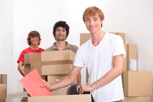 Local Waterloo movers loading furniture into a removal van