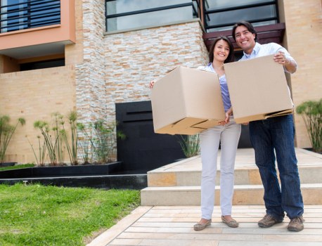 Careful wrapping of fragile household items during a Waterloo move